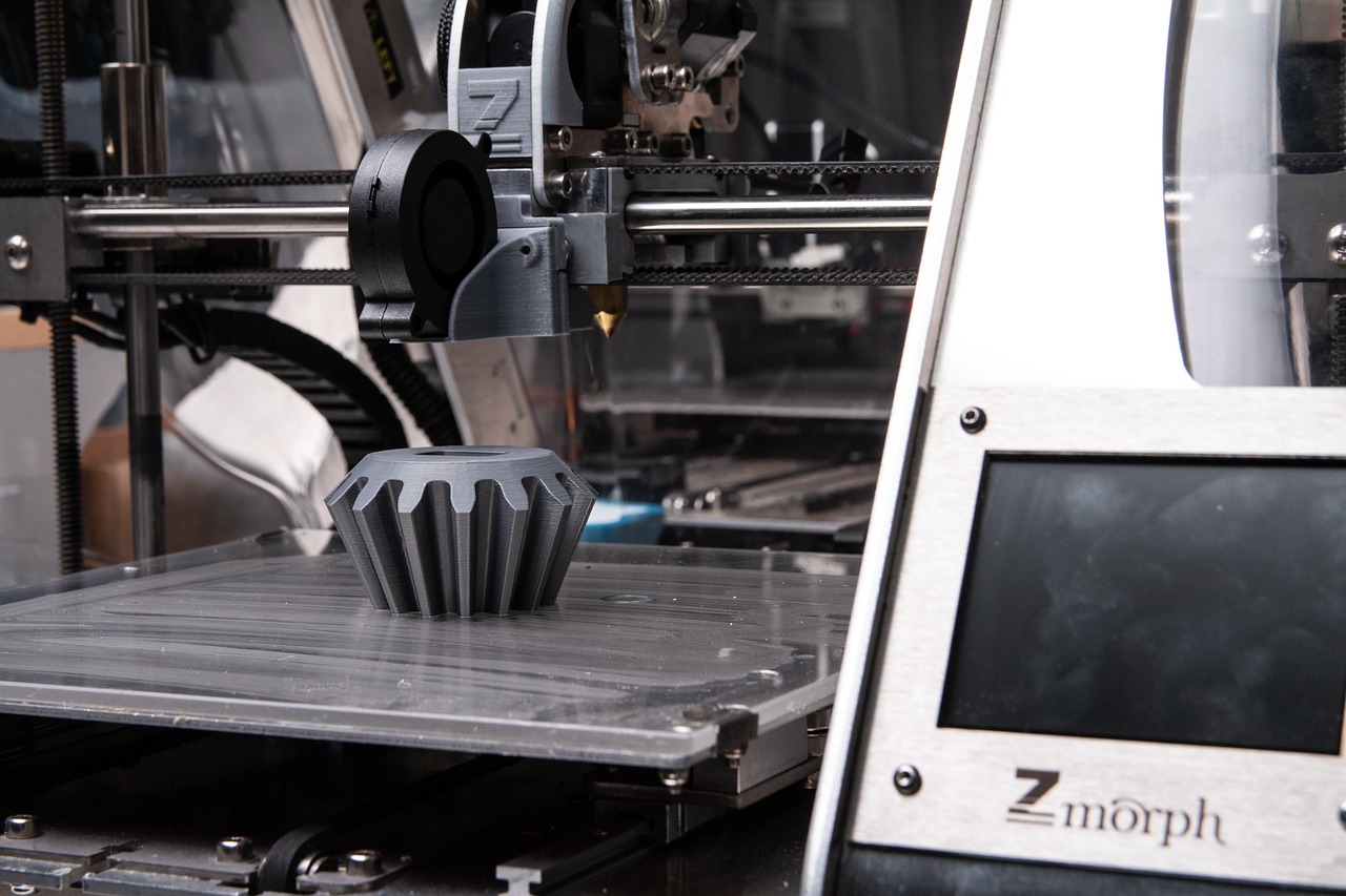 3D printer mechanical components in a workshop, showcasing the technology